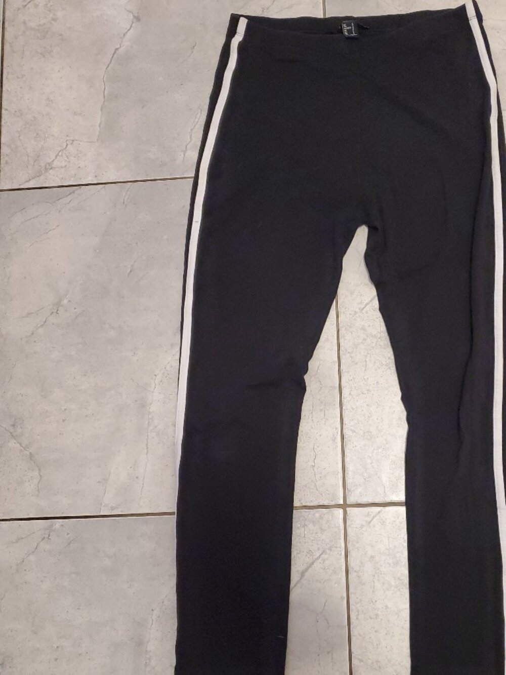 Leggings with a white line on the side.
